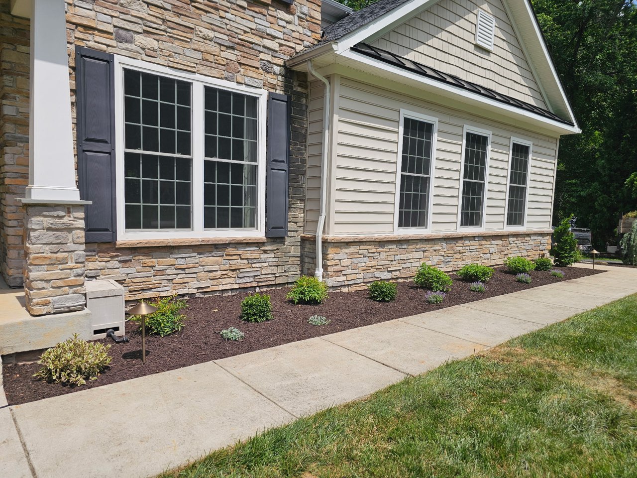 Oakfield crew installing a landscape bed