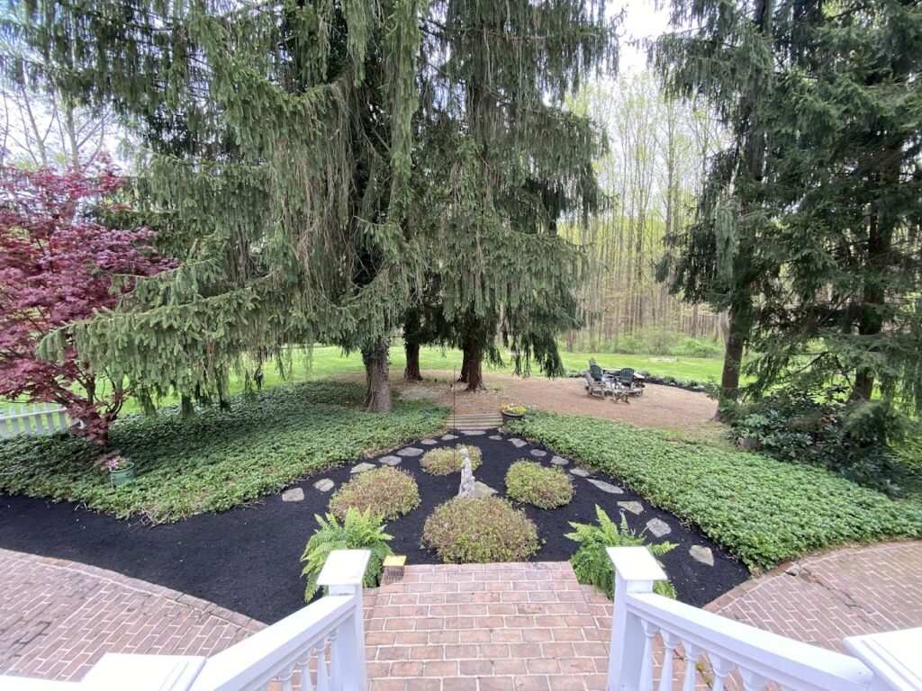 Foundation planting and ongoing bed care by Oakfield Landscaping