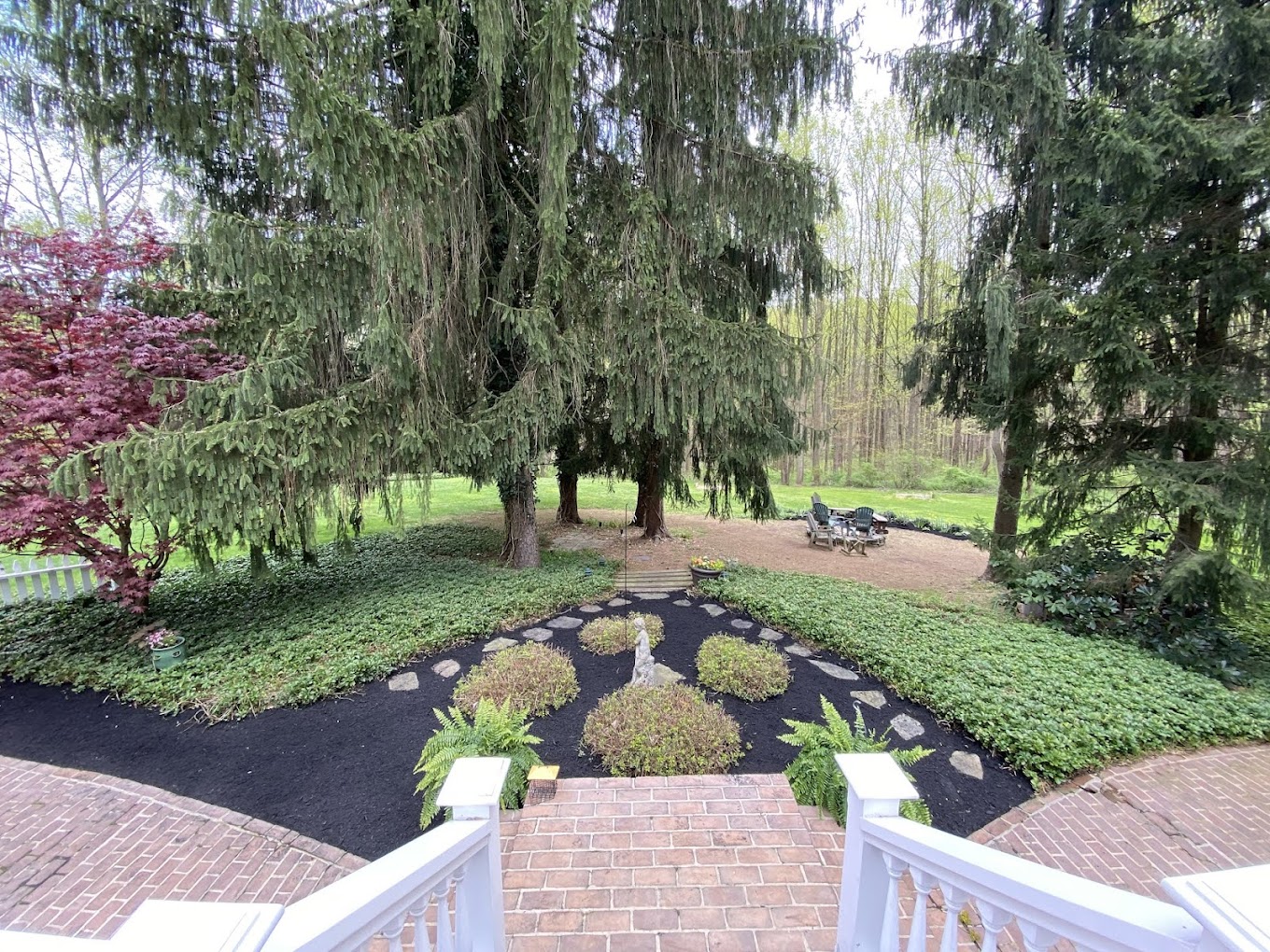 River-rock drainage bed softened with hardy plantings